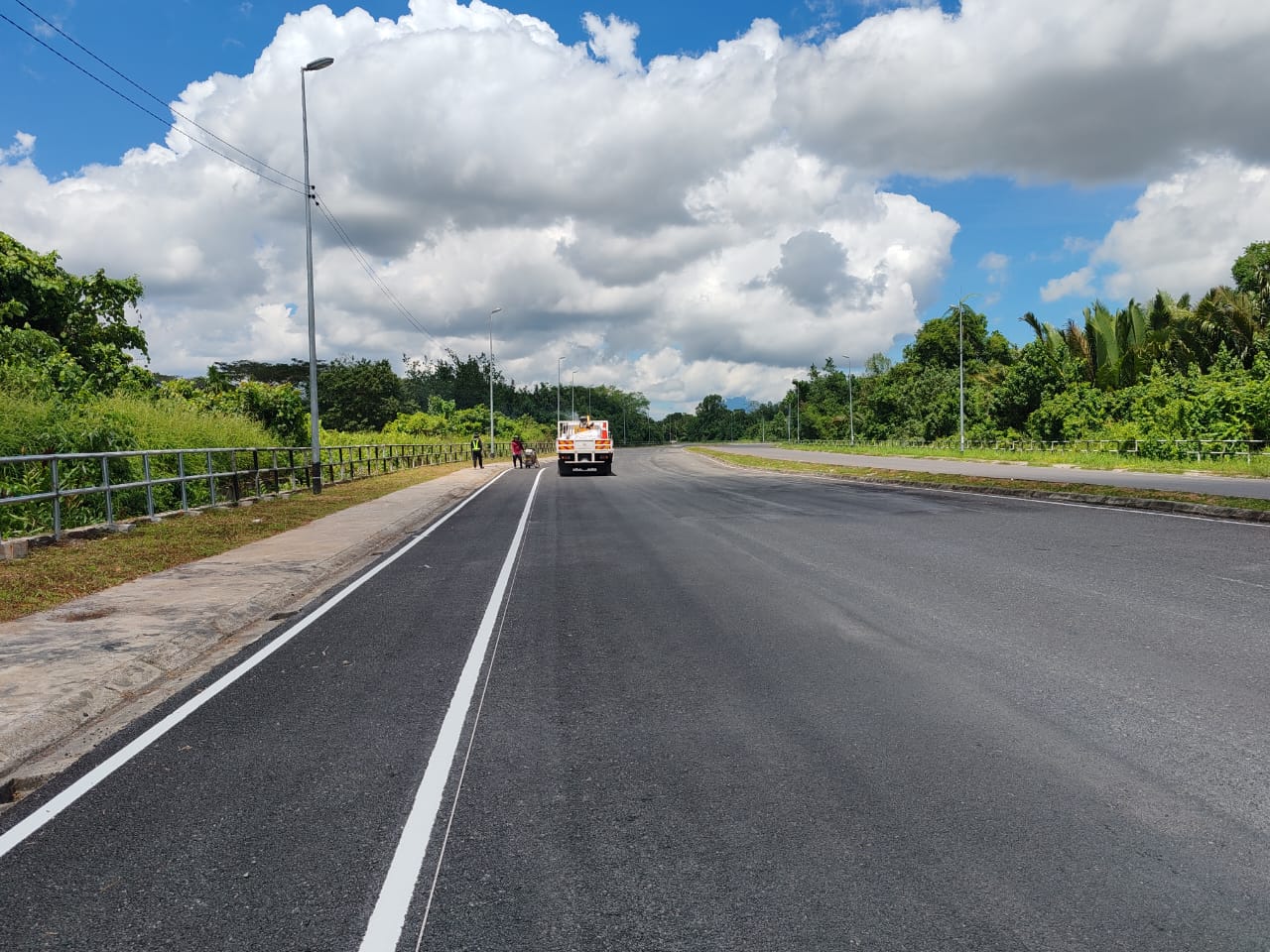 Freshly resurfaced road with new white road line marking